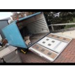 A four wheel box trailer with wheel clamp