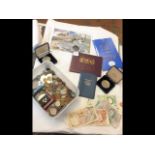 A collection of numismatic items - coins, bank not