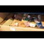 A box of dolls house furniture and accessories