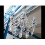 An elegant six branch crystal drop ceiling light