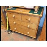 A pine chest of two short and two long drawers wit