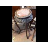 A Chinese hardwood plant stand with marble top - 92cm