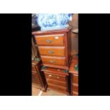 The matching pair of three drawer bedside cabinets