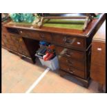 A reproduction mahogany pedestal desk with inset g