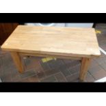 An oak coffee table on shaped legs