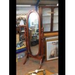 The matching hardwood cheval mirror with turned su