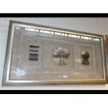 An Islamic style white metal triptych, framed and