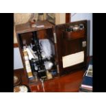 A Spencer Buffalo microscope with fitted case and