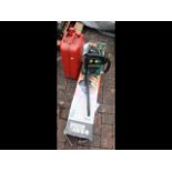 A petrol chainsaw, together with Black & Decker he