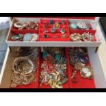 A cream jewellery box containing assorted costume