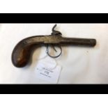 An antique pocket pistol with wooden grip - 17cms