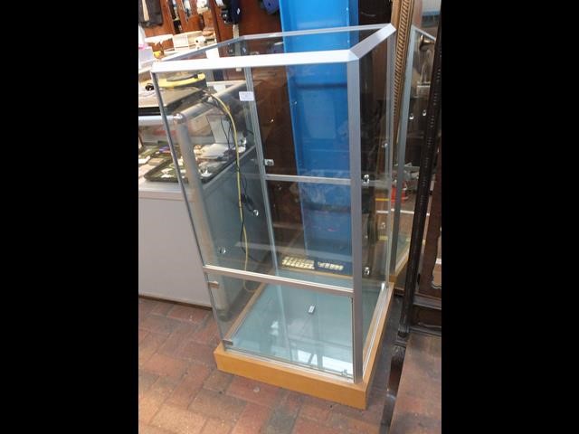 A modern glass display cabinet - 120cms high x 56c