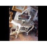 A decorative marble top console table with mirror