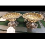 A pair of elegant silver gilt table salts, London