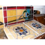 A pair of rectangular stain glass window panels to