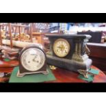 An antique Bakelite mantel clock and one other
