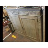 A 'Green Man' carved oak sideboard