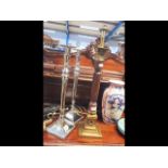 A pair of decorative silver plated candlesticks -