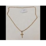 A 9ct gold chain with crucifix