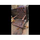 An antique style button back swivel office chair