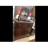 An antique mahogany chest of drawers