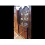 A reproduction display cabinet with cupboard under