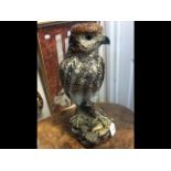 A large tin glazed pottery figure of bird of prey