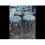 A set of eight cast metal pub stools