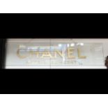 An original Chanel glass advertising sign - 107cm