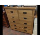 A modern light oak chest of drawers