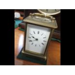 A 13cm high brass case carriage clock