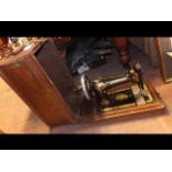 A vintage singer sewing machine in carrying case