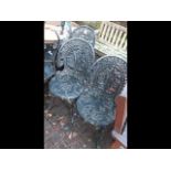 A set of four decorative cast metal pub/garden cha