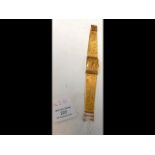 An 18ct gold Universal Genève wrist watch - total