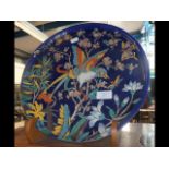 A 34cm diameter Longwy plate depicting birds and flowers