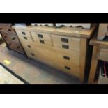 A modern light oak multi-drawer sideboard - 150cms