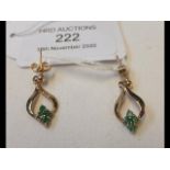 A pair of gold and emerald drop earrings