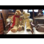 An old straw filled teddy bear and two others