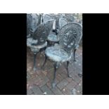 A set of four decorative cast metal pub/garden cha