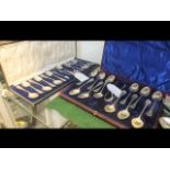 A set of twelve silver teaspoons with sugar tongs,