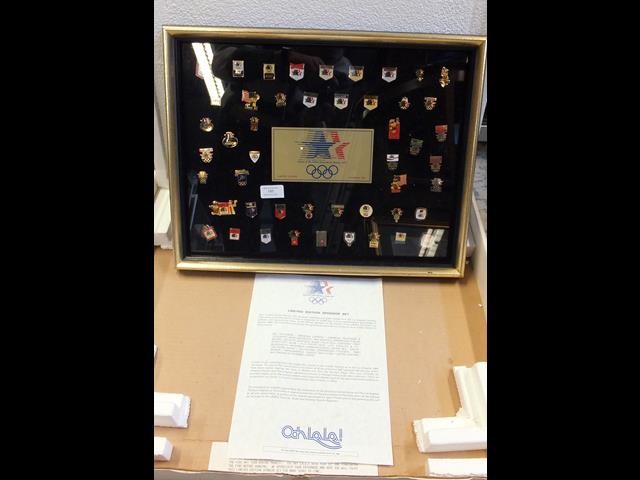 A Limited Edition 1984 Olympic game badges in pres