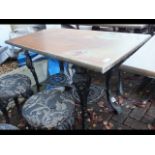 A cast metal and wooden pub/garden table