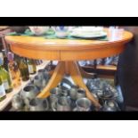 A circular yew wood coffee table