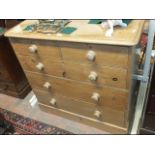 A Victorian pine chest of two short and three long