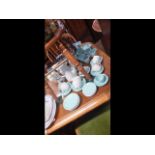 A collection of Poole pottery including tea sets,