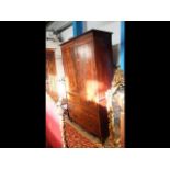 A 19th century mahogany linen press with four draw