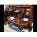 An oval mahogany occasional table on cabriole supp