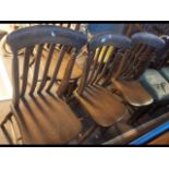 A set of four slat back chairs