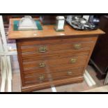 An antique chest of three long drawers