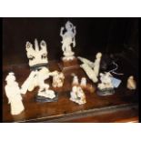Small carved ivory collectables including netsukes